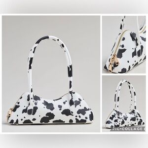 NWT new Anthropologie melie bianco east west shoulder bag cow print black white